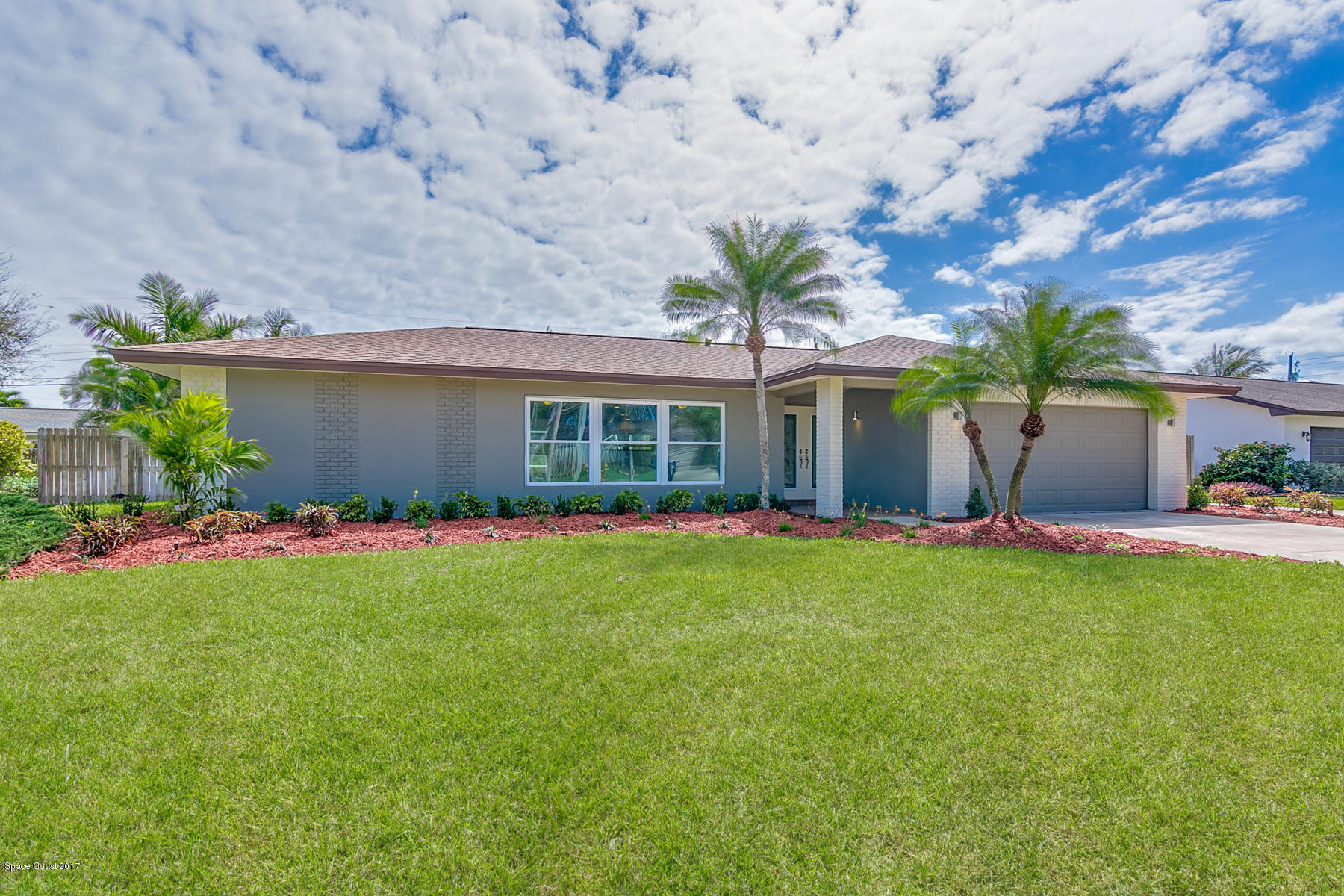 515 Rio Lane Melbourne, FL 32903 - Photo 1 of 15 a front view of a house with a garden and plants