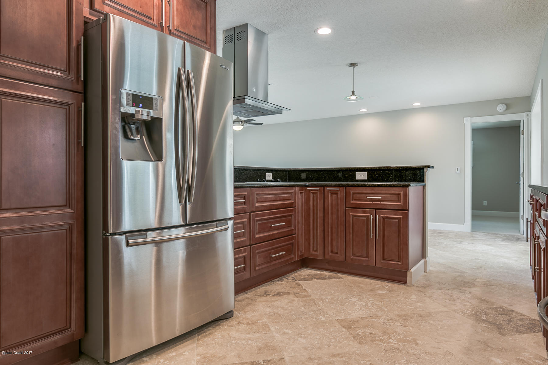 515 Rio Lane Melbourne, FL 32903 - Photo 8 of 15 a kitchen with stainless steel appliances a refrigerator and a sink