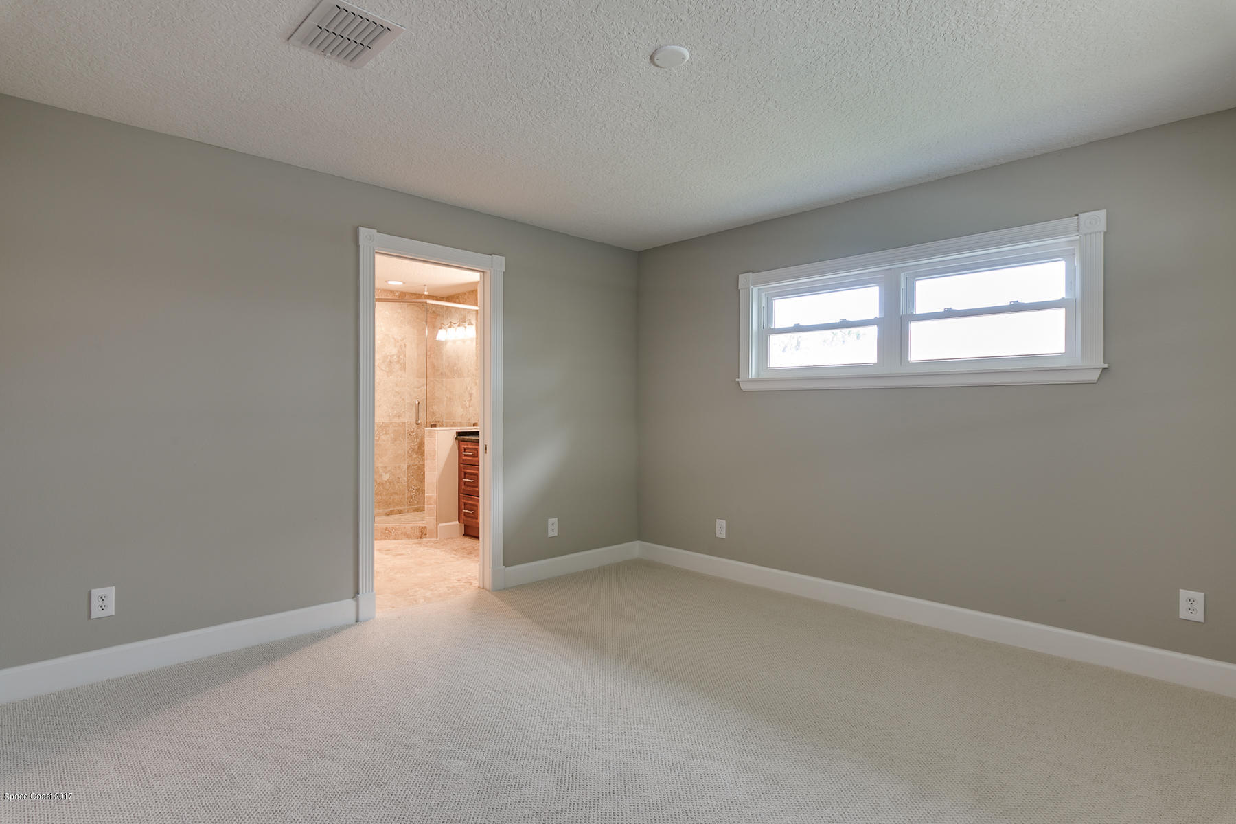 515 Rio Lane Melbourne, FL 32903 - Photo 10 of 15 an empty room with windows and closet