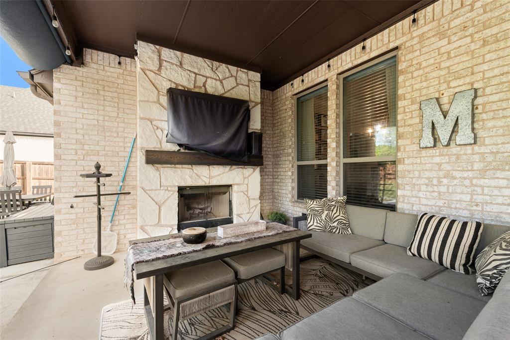 101 Oxford Court Weatherford, TX 76088 - Photo 30 of 35 Fireplace on patio