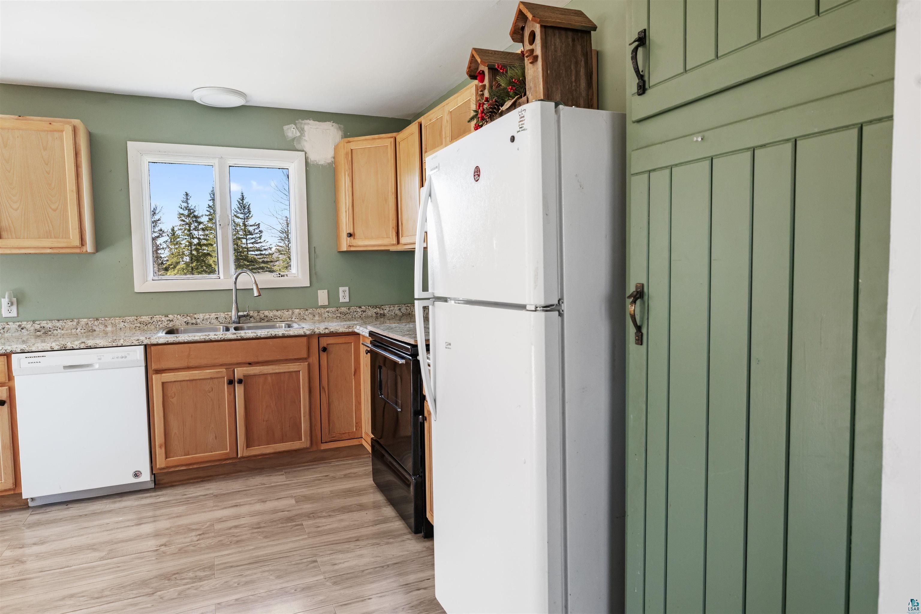 40139 County Road 251 Cohasset, MN 55721 - Photo 11 of 50 Kitchen featuring laminate flooring, natural wood cabinetry and laminate countertops