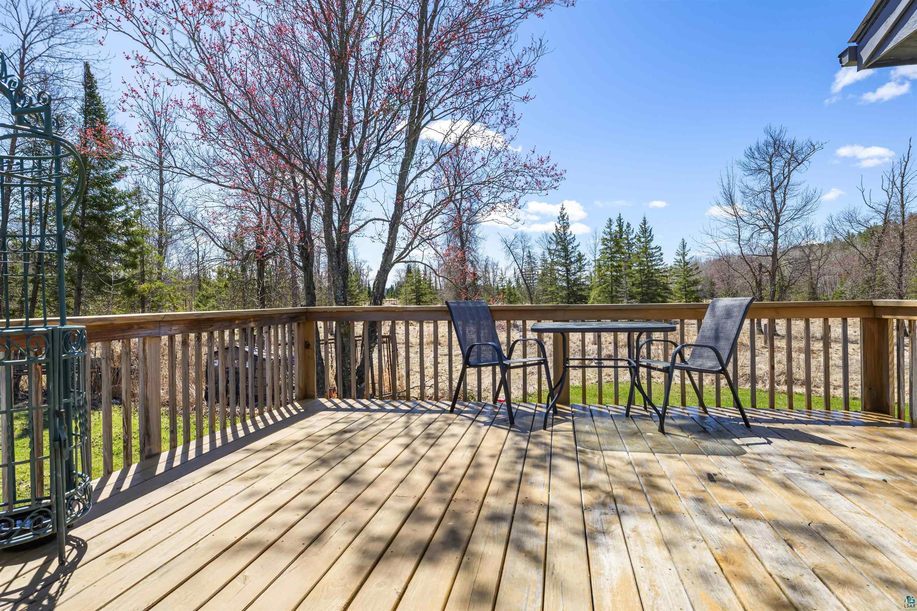 40139 County Road 251 Cohasset, MN 55721 - Photo 28 of 50 Spacious wood deck with natural wood railing, offering ample outdoor living space