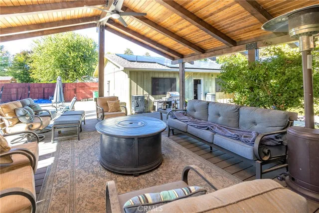 a living room with furniture a large window and a table