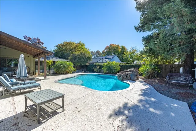 a view of a swimming pool with a patio