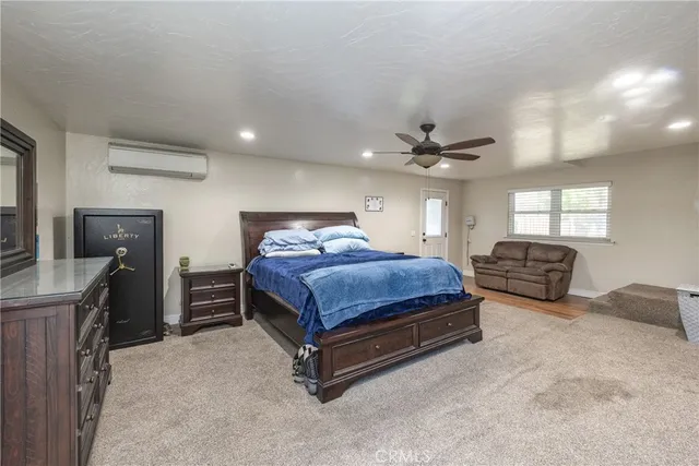 a bedroom with bed and window