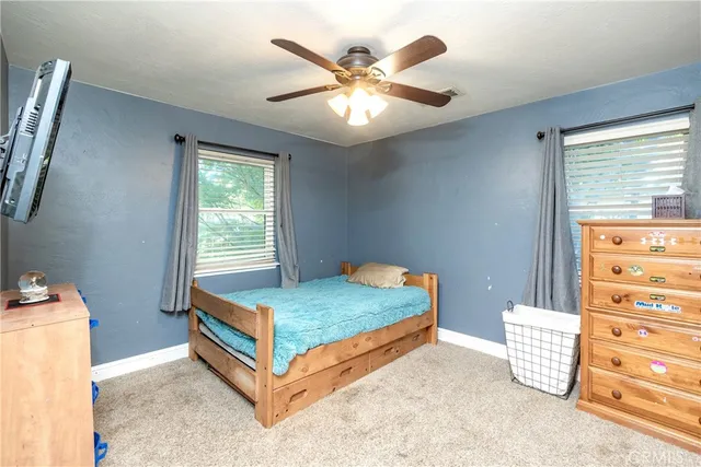 a bedroom with a bed and a table