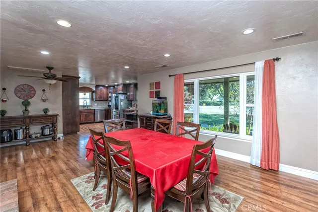 a view of a dining room with furniture window and wooden floor