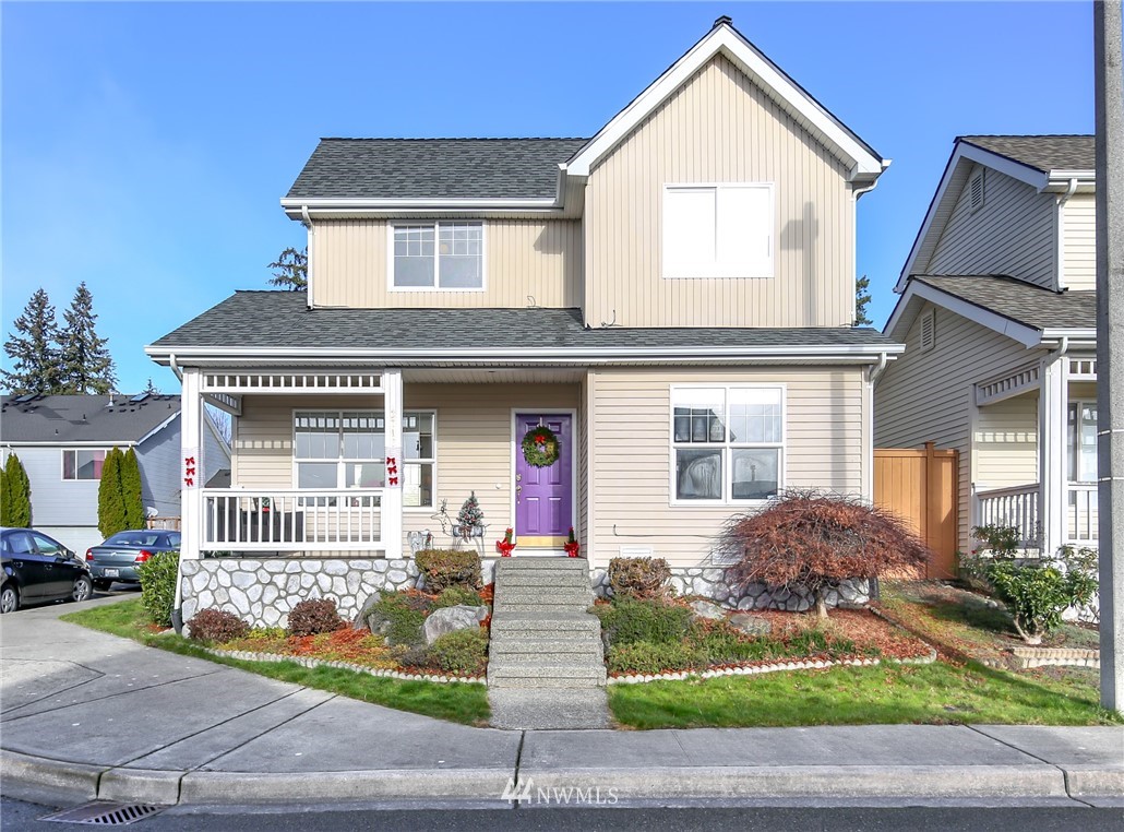 3716 Northeast 5th Place Renton, WA 98056 - Photo 1 of 29 a front view of a house with a yard