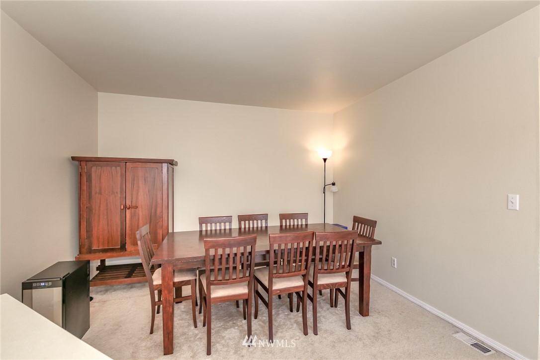 3716 Northeast 5th Place Renton, WA 98056 - Photo 12 of 29 a dining room with furniture and wooden floor