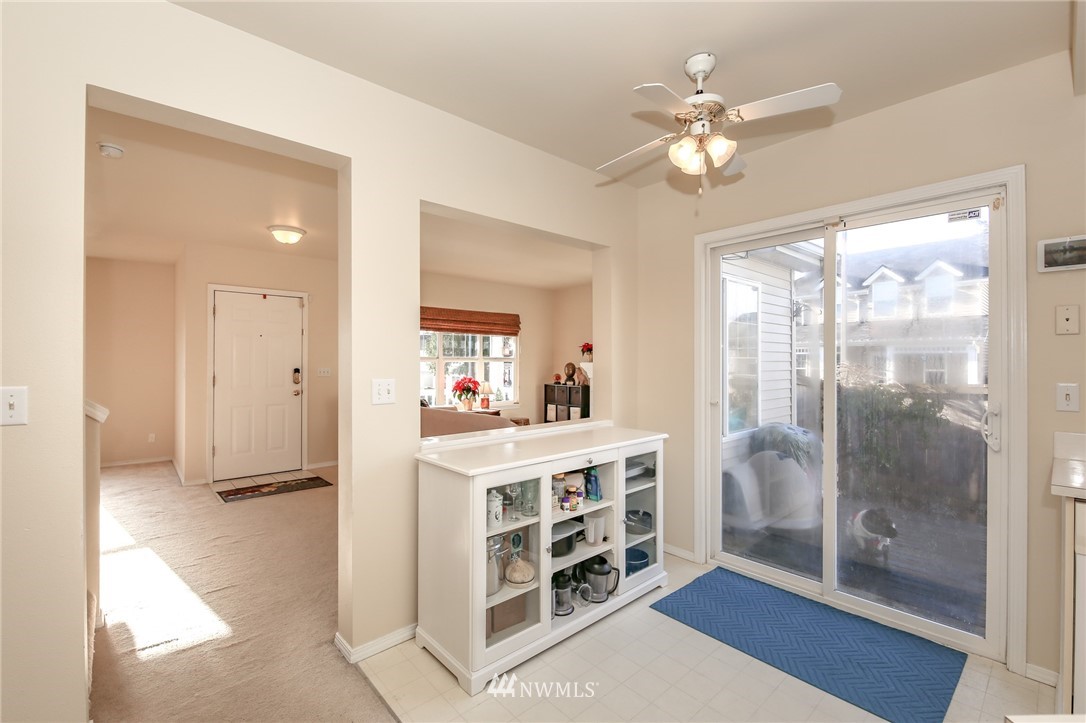 3716 Northeast 5th Place Renton, WA 98056 - Photo 15 of 29 a view of a livingroom with a window and a ceiling fan