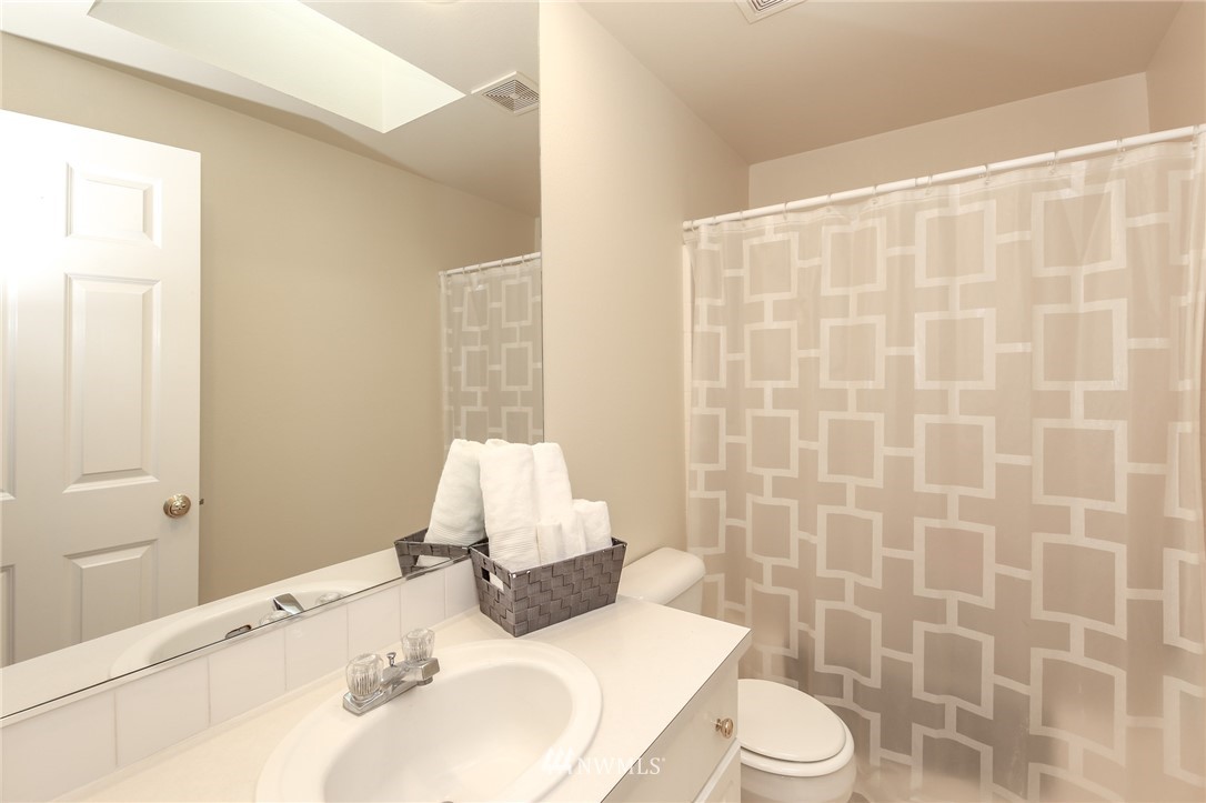3716 Northeast 5th Place Renton, WA 98056 - Photo 19 of 29 a bathroom with a sink and a mirror
