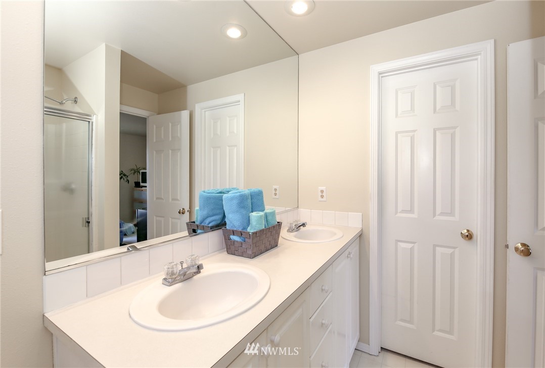 3716 Northeast 5th Place Renton, WA 98056 - Photo 22 of 29 a bathroom with a sink and a mirror