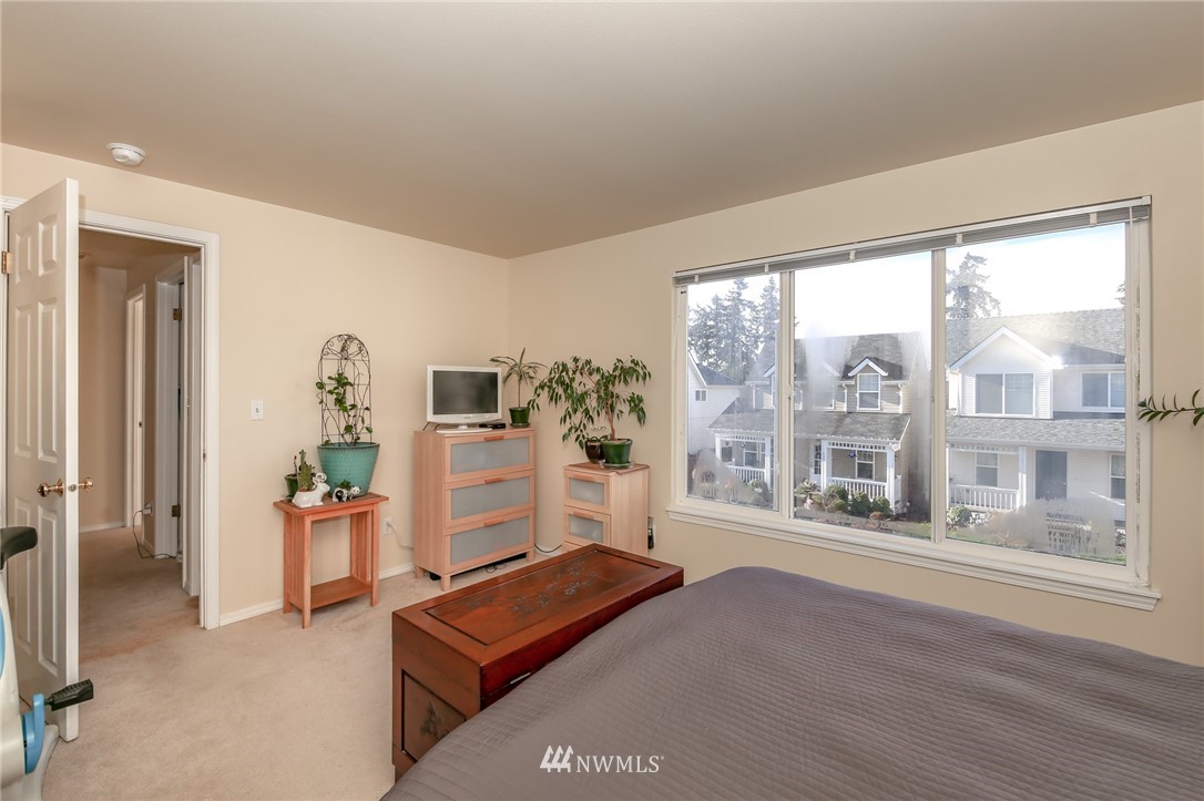 3716 Northeast 5th Place Renton, WA 98056 - Photo 23 of 29 a living room with furniture and large windows