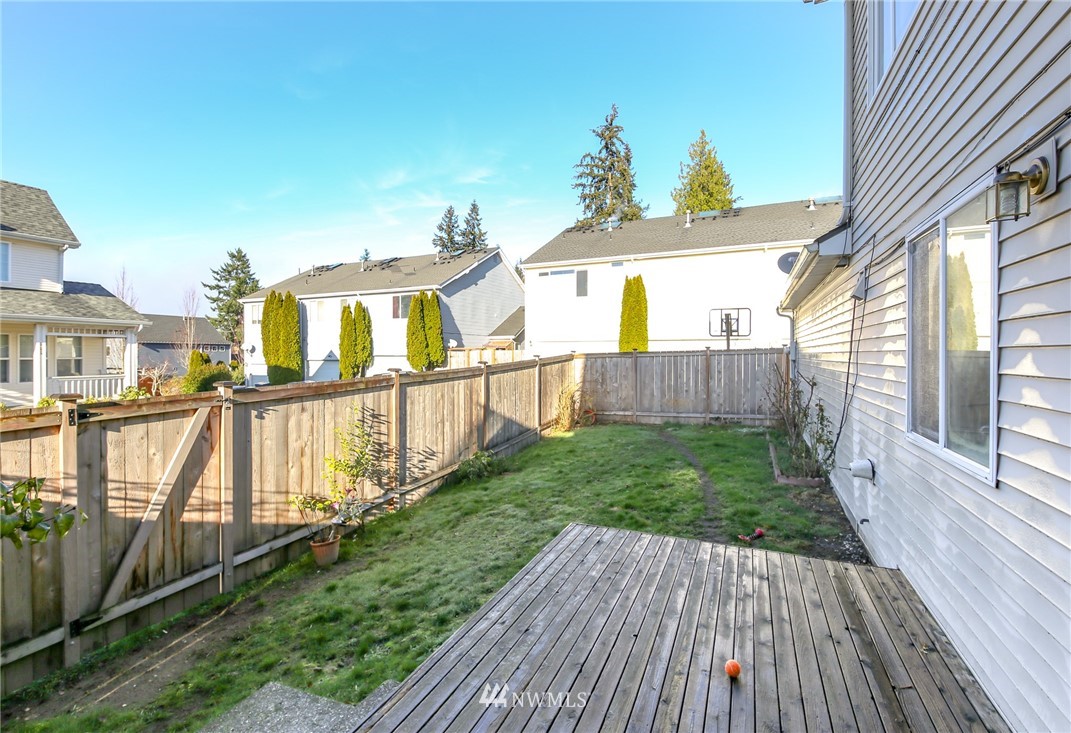 3716 Northeast 5th Place Renton, WA 98056 - Photo 25 of 29 a view of a house with backyard and wooden fence