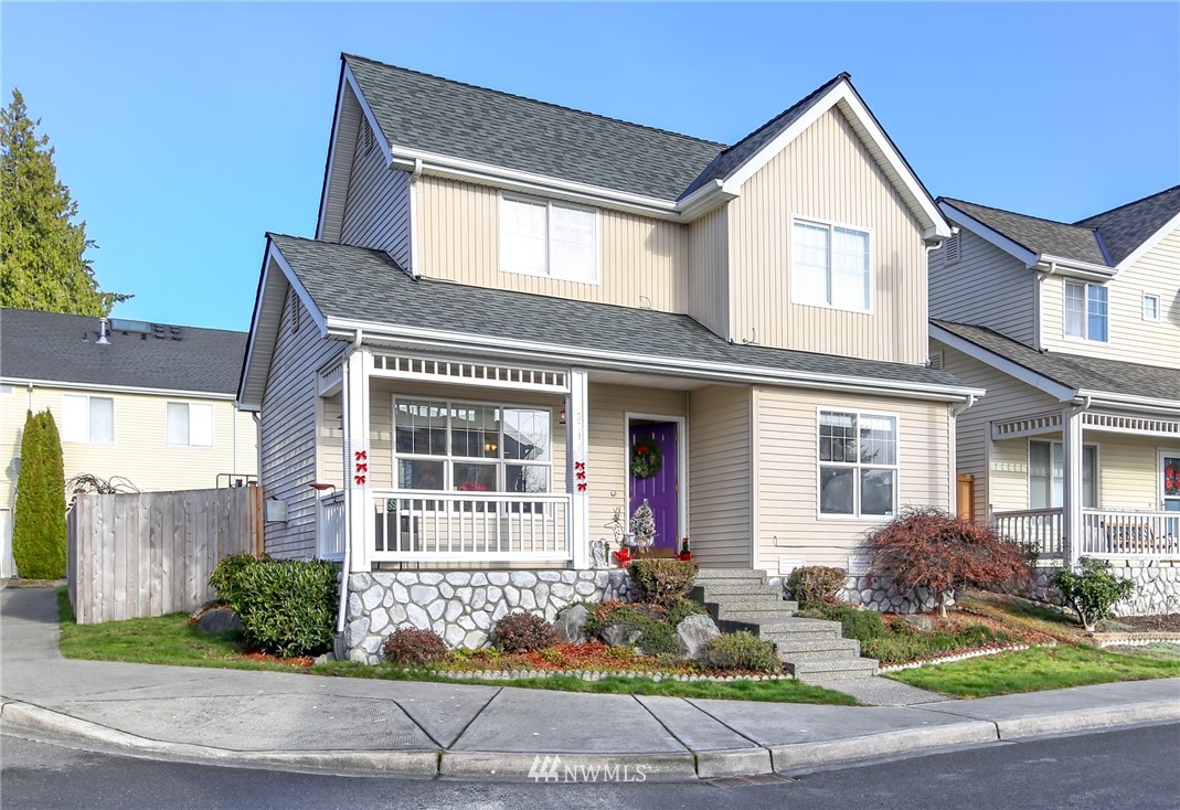 3716 Northeast 5th Place Renton, WA 98056 - Photo 28 of 29 a front view of a house with garden