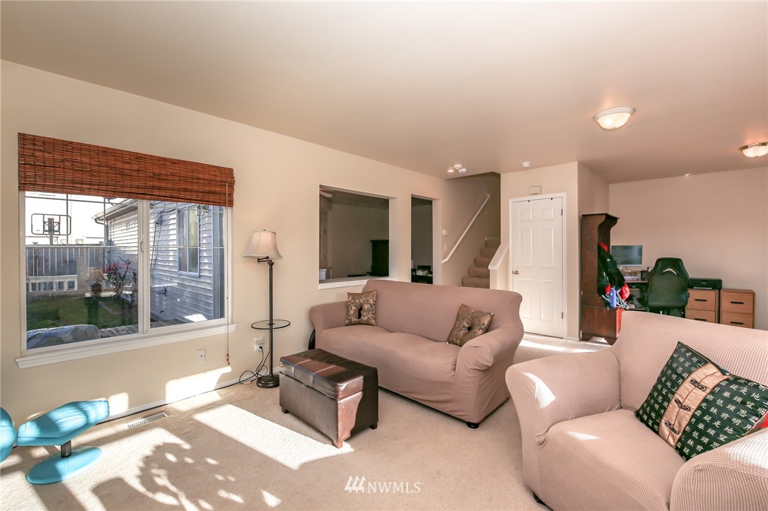 3716 Northeast 5th Place Renton, WA 98056 - Photo 6 of 29 a living room with furniture and a large window