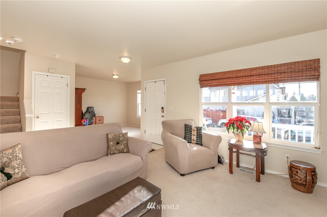 3716 Northeast 5th Place Renton, WA 98056 - Photo 7 of 29 a living room with furniture and a large window
