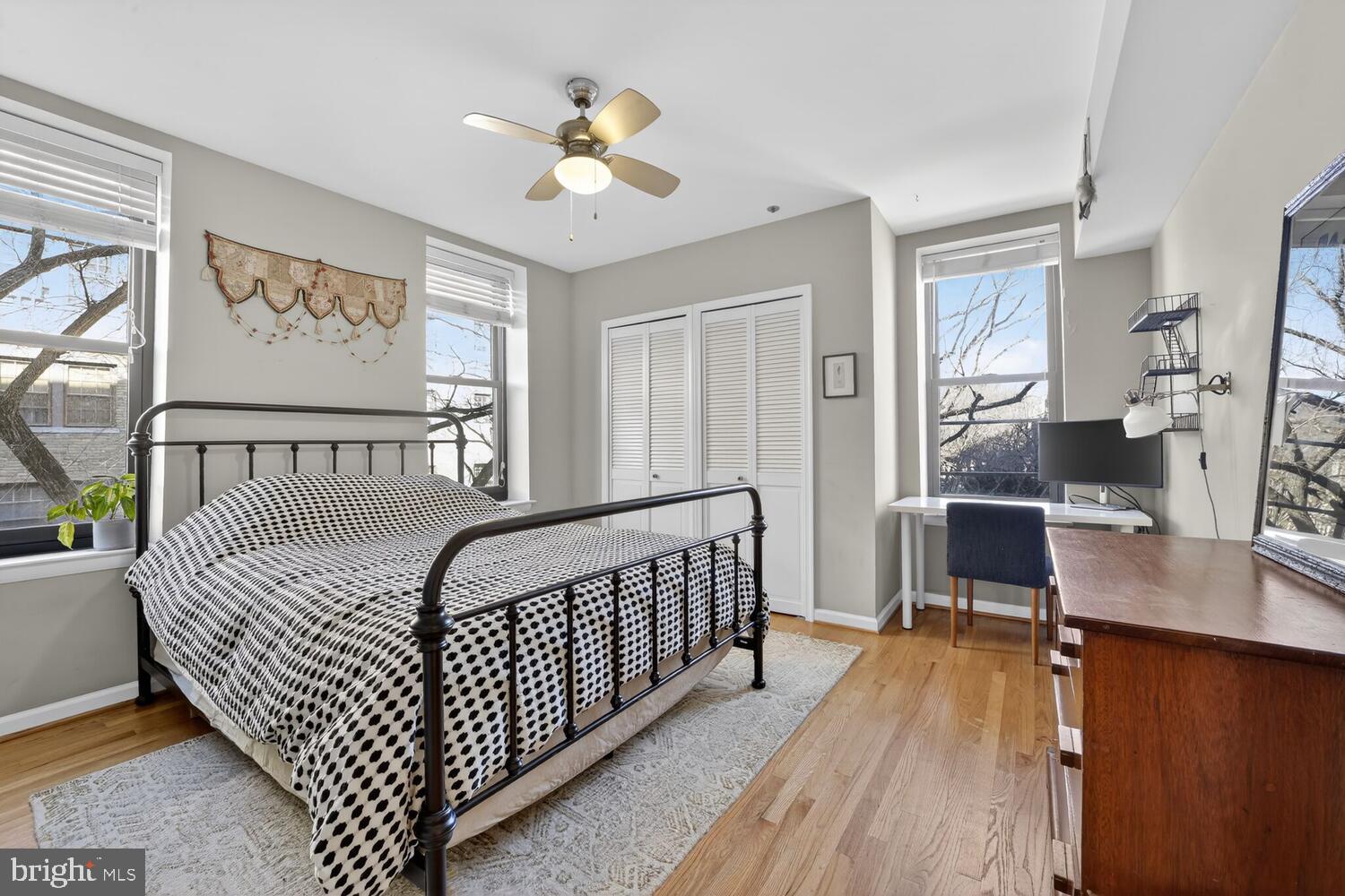 2633 Adams Mill Road Northwest, Unit 205 Washington, DC 20009 - Photo 12 of 18 a bedroom with furniture and a window