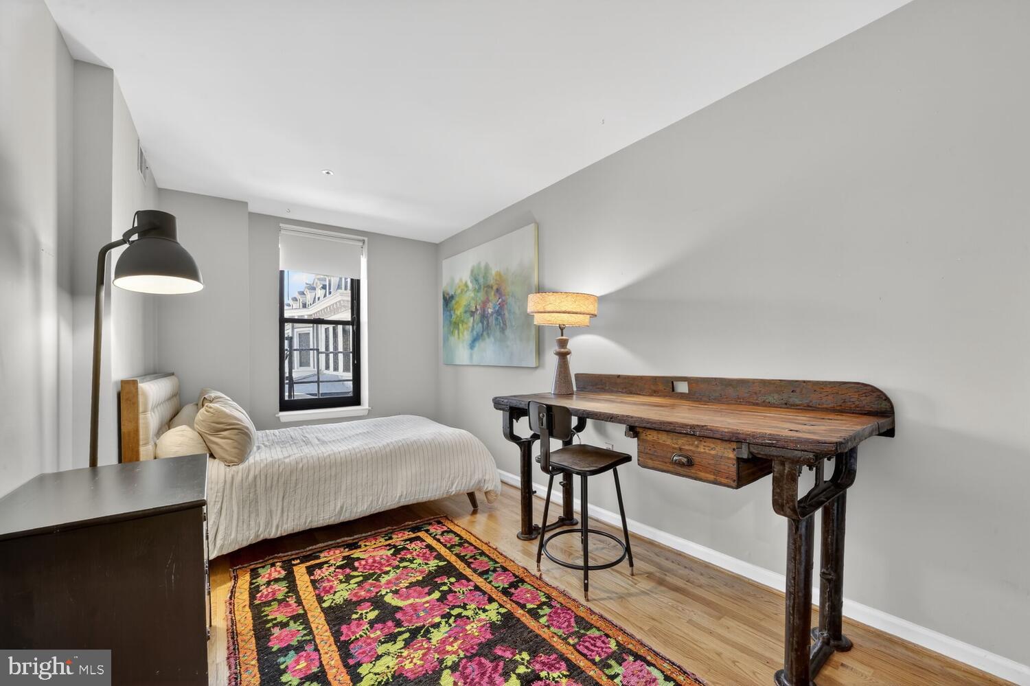 2633 Adams Mill Road Northwest, Unit 205 Washington, DC 20009 - Photo 15 of 18 a bed room with furniture and a window