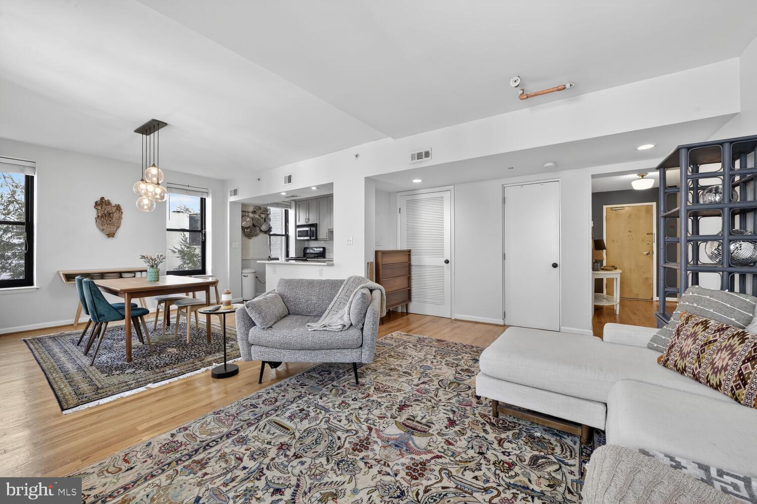 2633 Adams Mill Road Northwest, Unit 205 Washington, DC 20009 - Photo 3 of 18 a living room with furniture and a couch