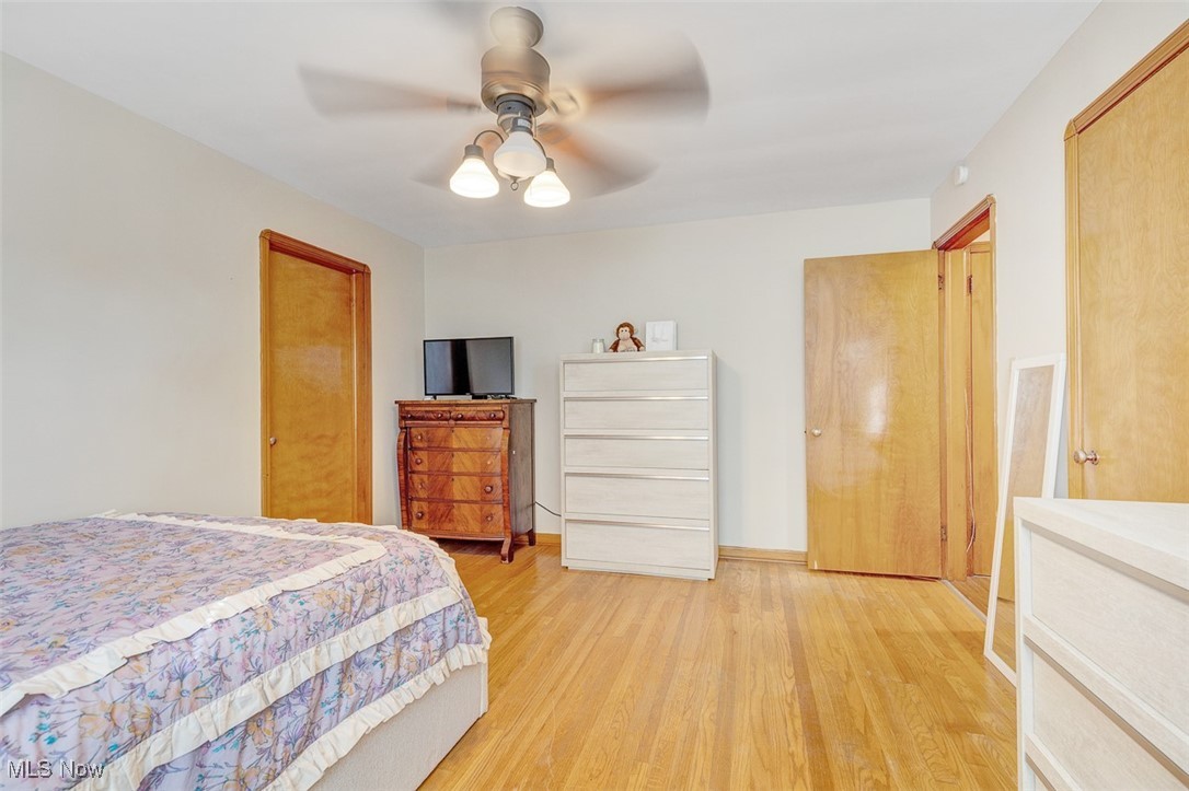 6136 Ridge Road Cleveland, OH 44129 - Photo 27 of 40 Bedroom featuring light wood-style floors and ceiling fan