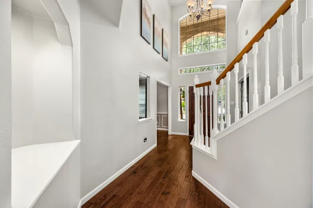 a view of entryway with wooden floor and stairs