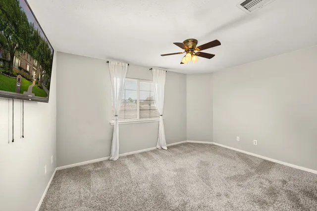 a bathroom with a sink a toilet a mirror and shower