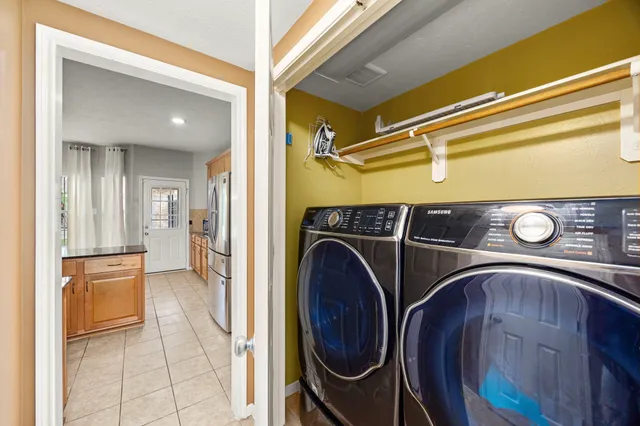 a view of a backyard with sitting area