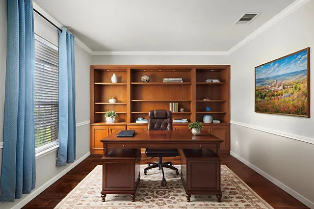 a workspace with furniture and window