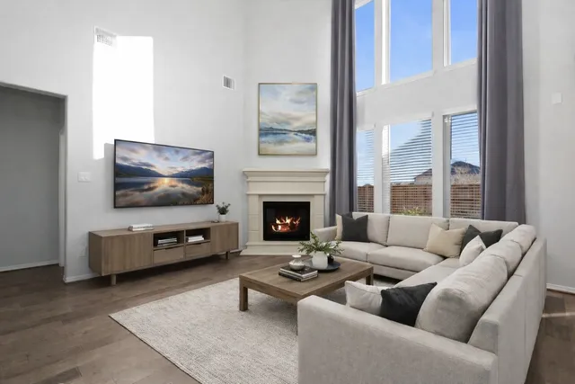 a kitchen with stove a sink and chairs