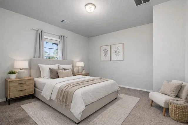 a bathroom with a granite countertop sink a toilet and shower