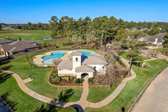 an aerial view of a house having swimming pool