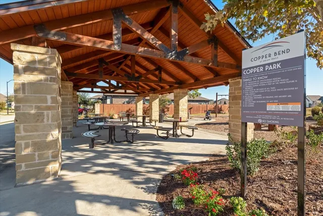 an aerial view of residential houses with outdoor space and swimming pool