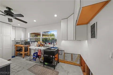 a room with lots of table and chairs