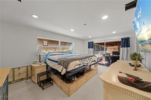 a bedroom with a bed and a table