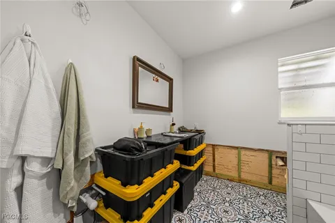 a bathroom with a sink toilet and mirror