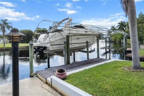 a view of a backyard with sitting area and slide