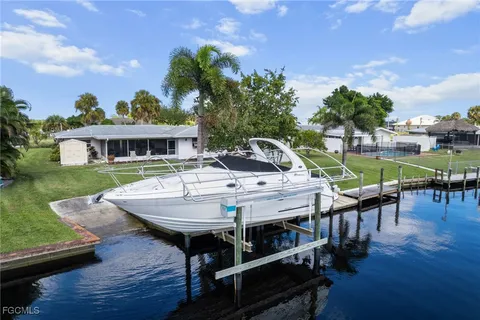 a view of a house with pool table and chairs