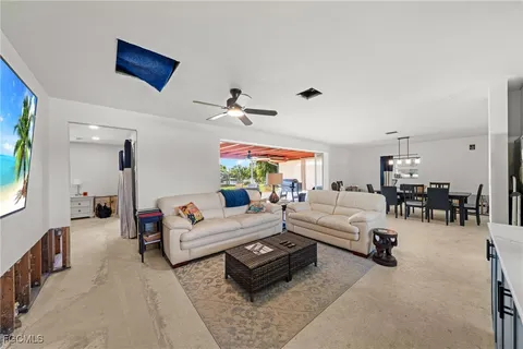a living room with furniture and white walls