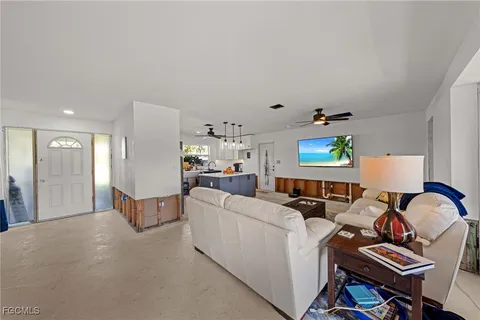 a living room with furniture and a window