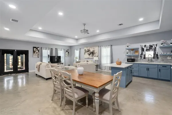 a view of a dining room with furniture and window