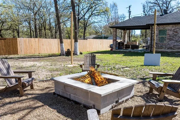 a living room with large windows and furniture