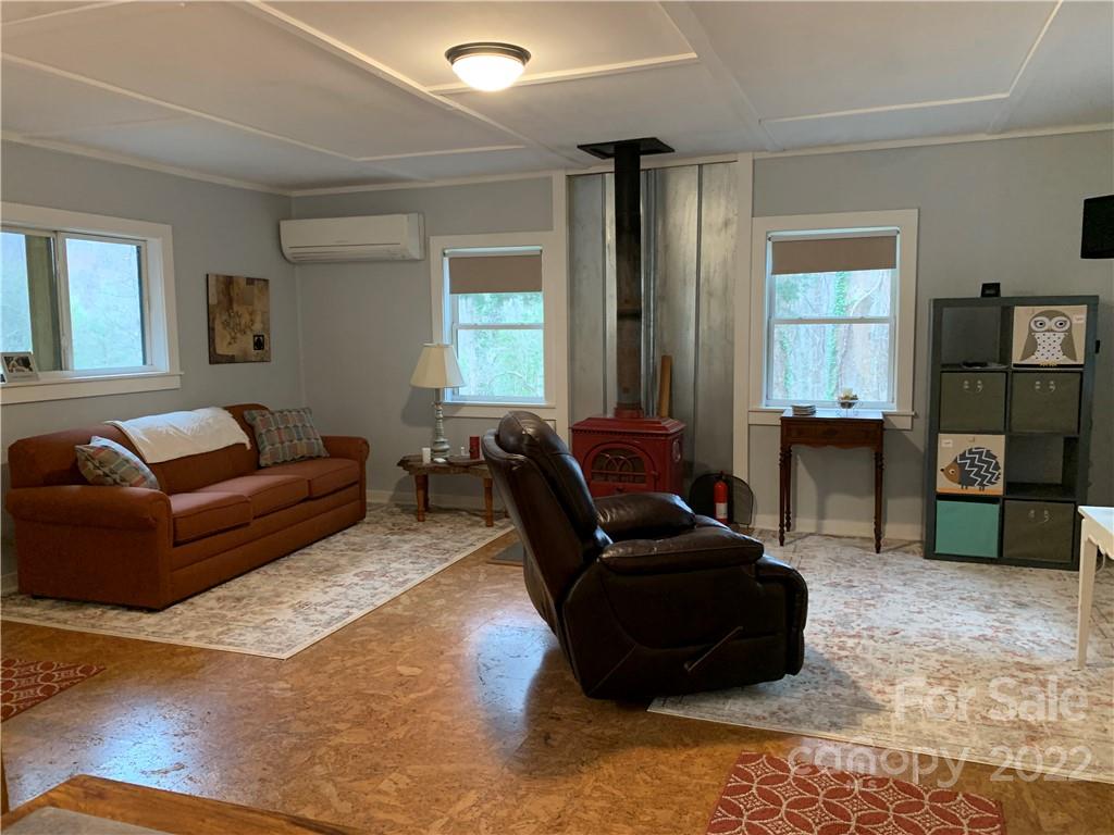 445 Autumn Lane Tryon, NC 28782 - Photo 11 of 27 a living room with furniture and a window