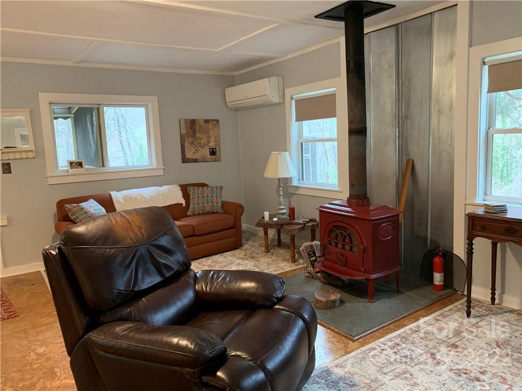 445 Autumn Lane Tryon, NC 28782 - Photo 12 of 27 a living room with furniture and a window