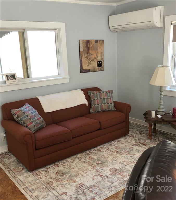 445 Autumn Lane Tryon, NC 28782 - Photo 13 of 27 a living room with furniture and a window