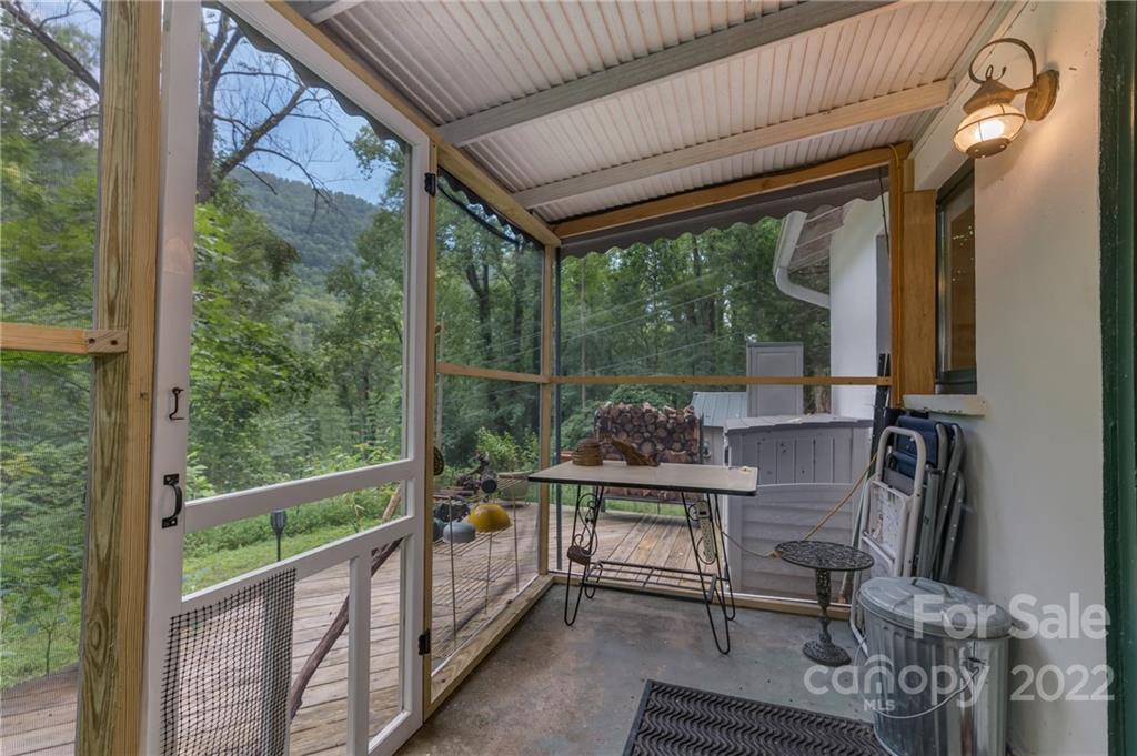 445 Autumn Lane Tryon, NC 28782 - Photo 21 of 27 a view of a chairs and table in the balcony