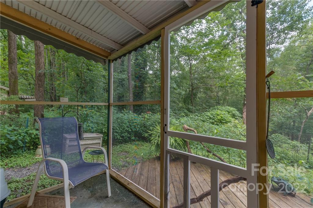 445 Autumn Lane Tryon, NC 28782 - Photo 22 of 27 a view of a chair and table in the balcony