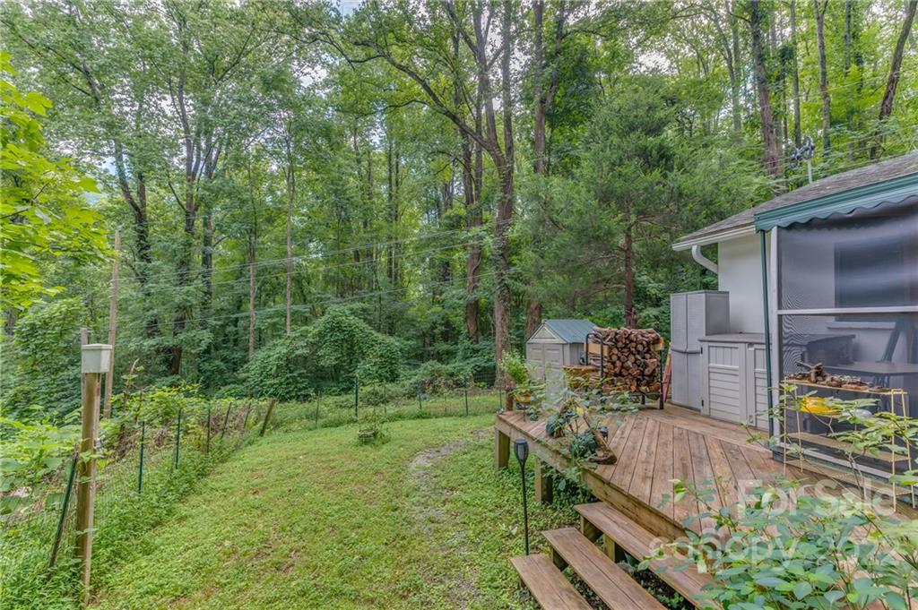 445 Autumn Lane Tryon, NC 28782 - Photo 6 of 27 a view of a backyard with hardwood