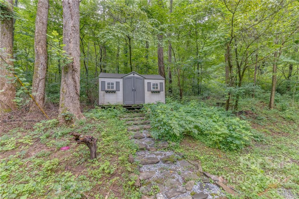 445 Autumn Lane Tryon, NC 28782 - Photo 10 of 27 a garden view with a trees