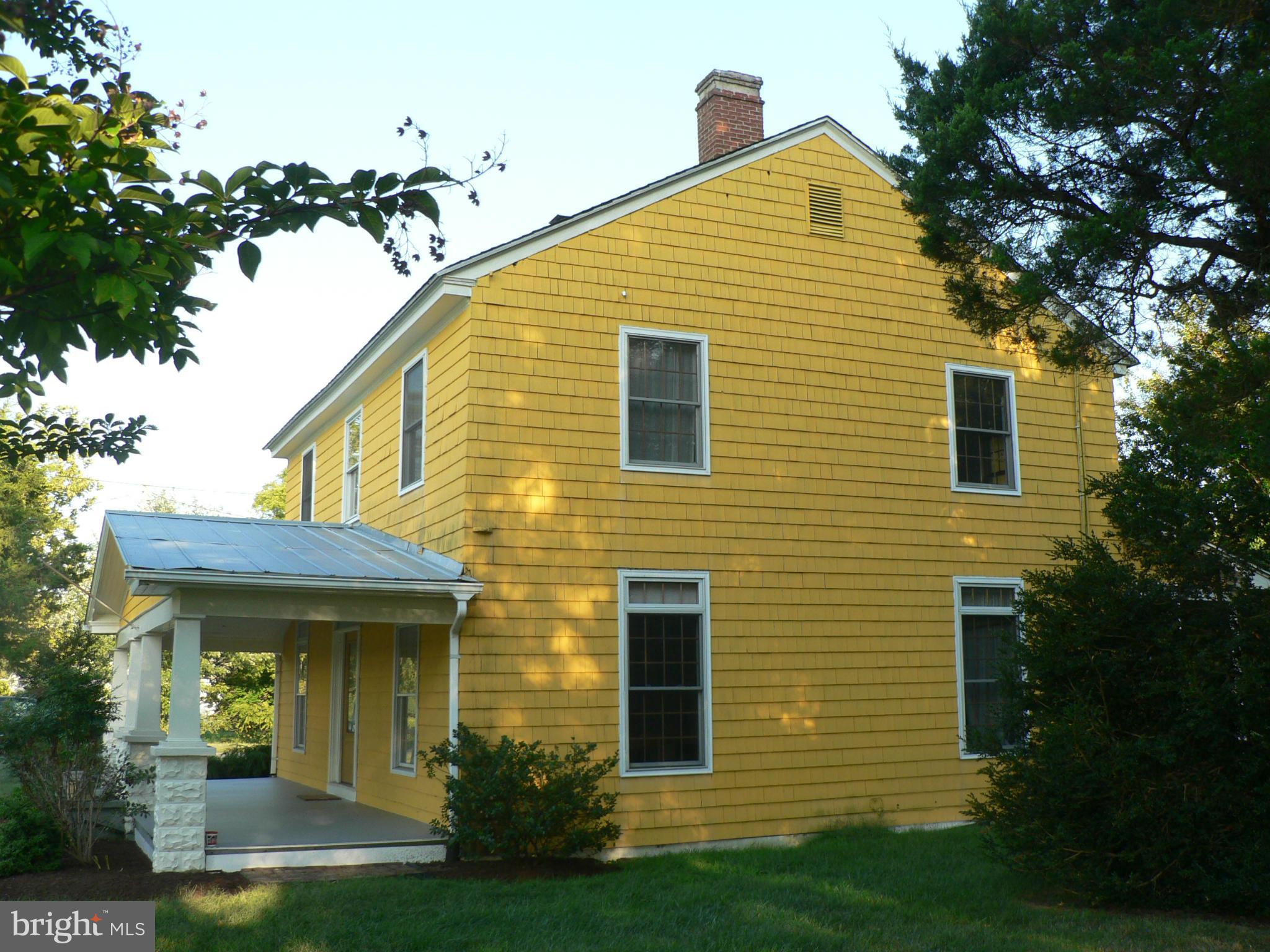 7041 Thorneton Road St. Michaels, MD 21663 - Photo 15 of 19 a front view of a house with garden
